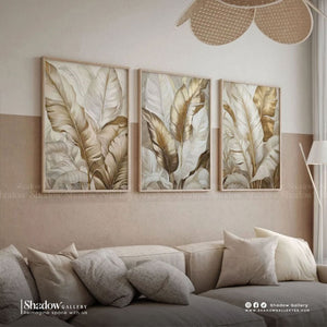 Gold Banana Leaves Triptych Wall Art Set – styled in a modern room setting